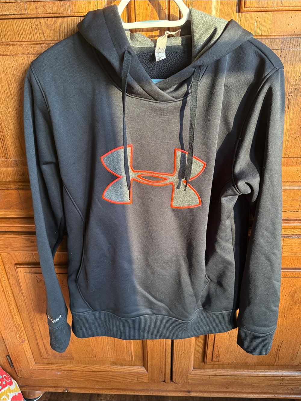 Under Armour Black Hoodie with Orange Logo Outline
